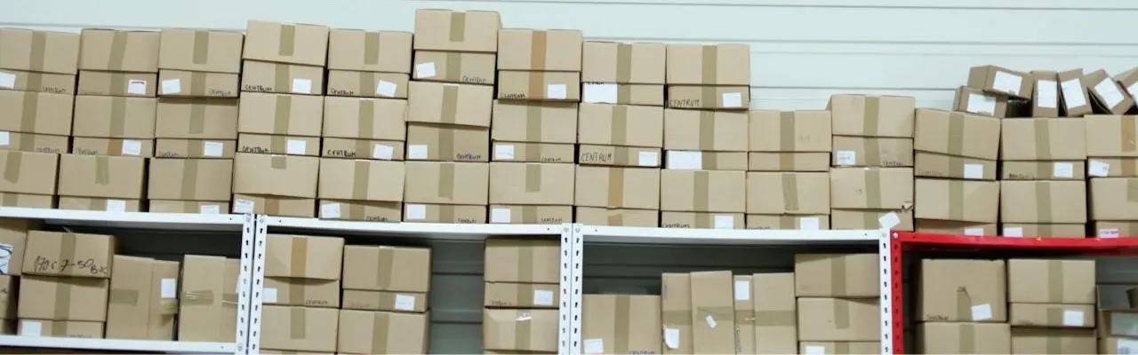 several boxes stacked on top of a rack in a warehouse