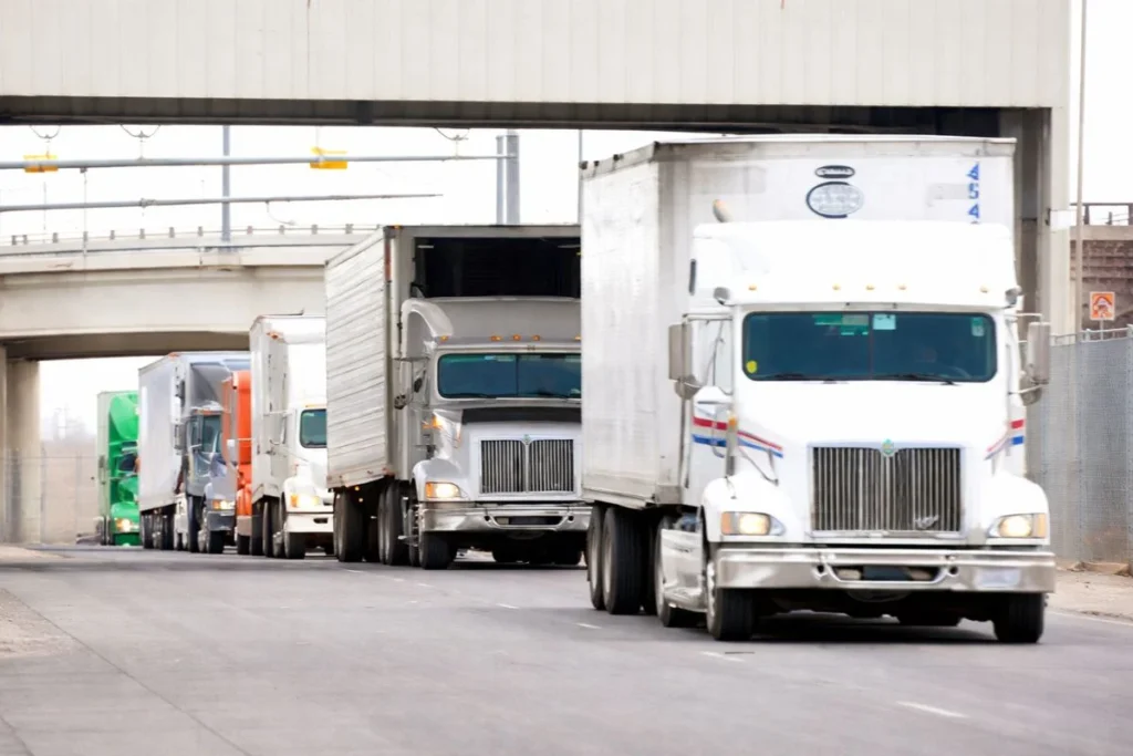 Is it cheaper to transload at the US-Mexico border or use direct through-trailer shipping?